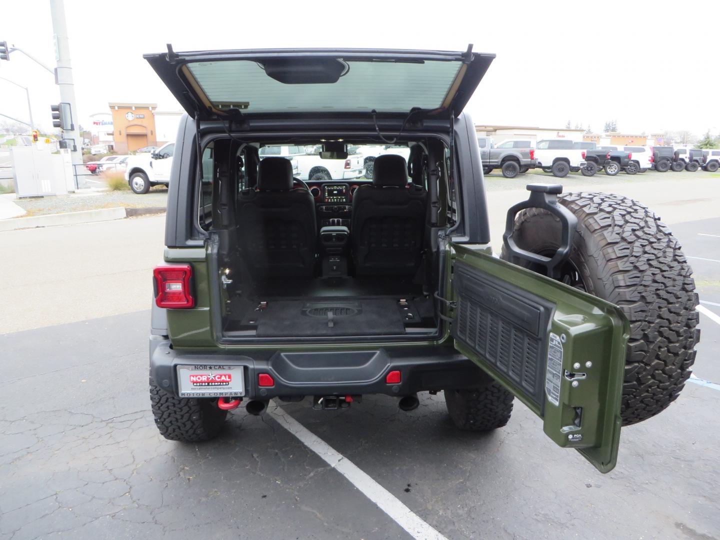 2021 Sarge Green /BLACK Jeep Wrangler Rubicon (1C4HJXCN4MW) with an 2.0L L4 DOHC 16V TURBO engine, 6A transmission, located at 2630 Grass Valley Highway, Auburn, CA, 95603, (530) 508-5100, 38.937893, -121.095482 - Rubicon featuring a Mopar suspension system, Fox shocks, 17" Fuel Wheels, BFG KO2 tires, Maxximus 3 front bumper stinger, Dual exhaust, Bolt hitch lock, Mopar HD tailgate hinge, and a custom cargo platform. - Photo#40